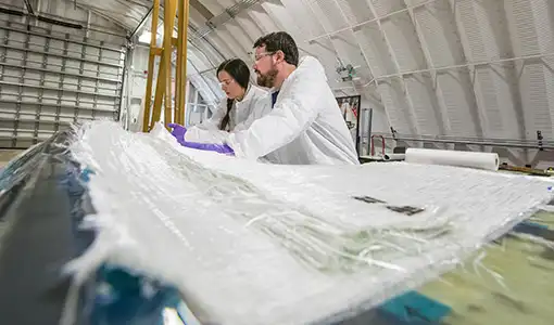 Continue reading about Two people in a large warehouse laboratory