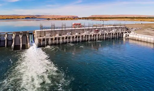 Continue reading about Photo of a hydropower generating station spanning a wide river.