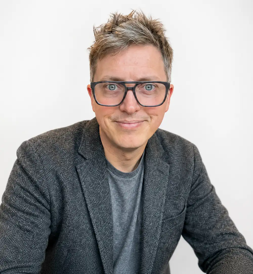 20260901-from-tony-stark-obi-wan-kenobi-meet-4-west-gate-fellows-and-their-technologies-ryan-brow Portrait of a person wearing glasses.