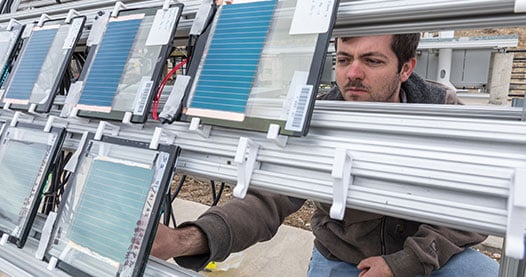 A researcher working outside.