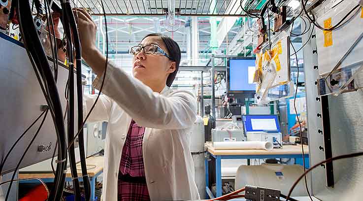 Scientist working with a mobility machine