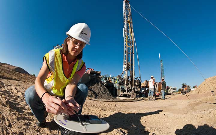 Researcher examines a heat sensor.