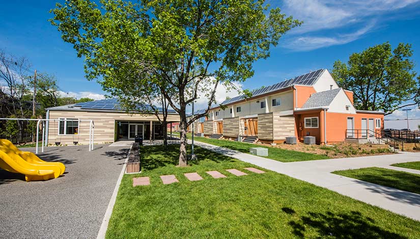 Two school buildings featuring rooftop solar installations.