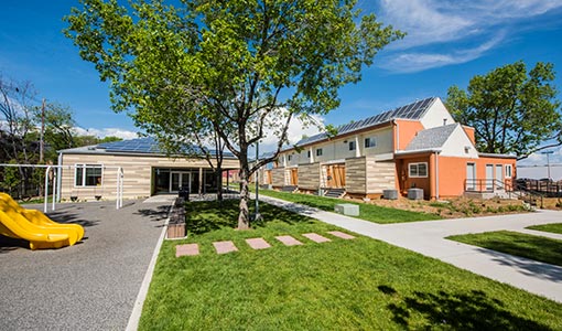 Two school buildings featuring rooftop solar installations.
