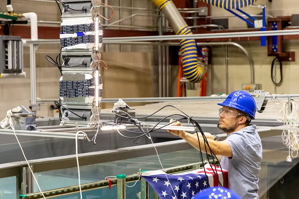 An NREL researcher validating marine energy devices in a wave tank.