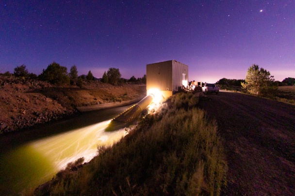 Hydropower dam lit up at night