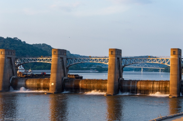 Hydroelectric dam with bridge in the background