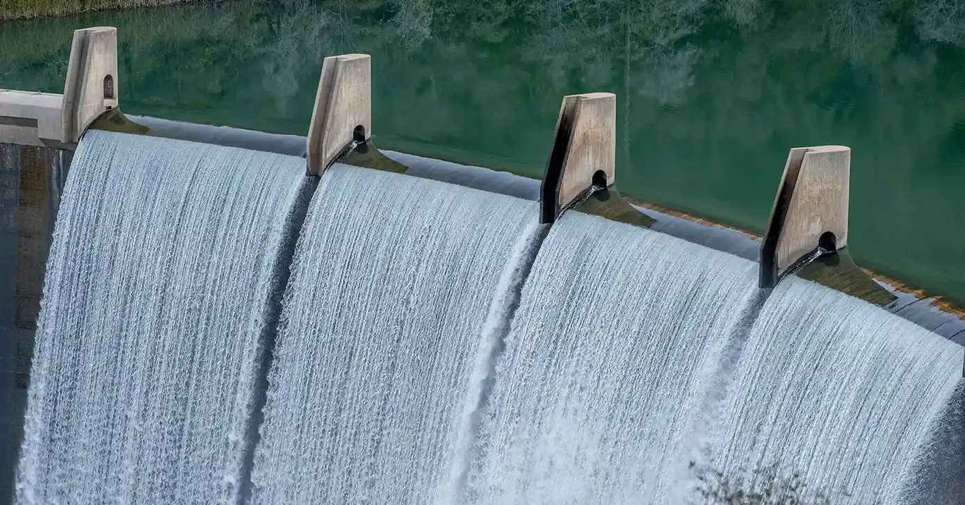 Water flowing over a dam.