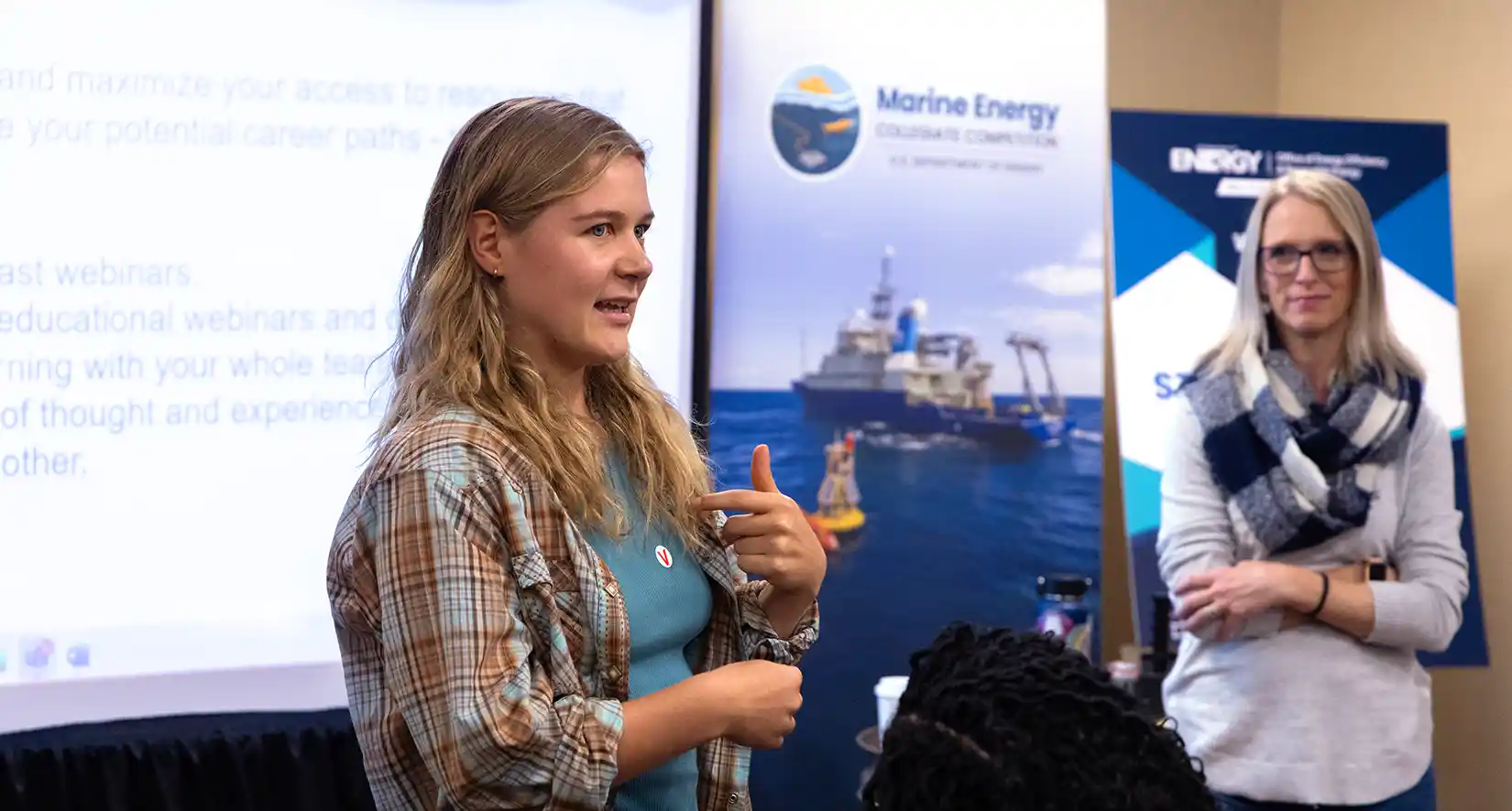 Student presents ideas at competition.