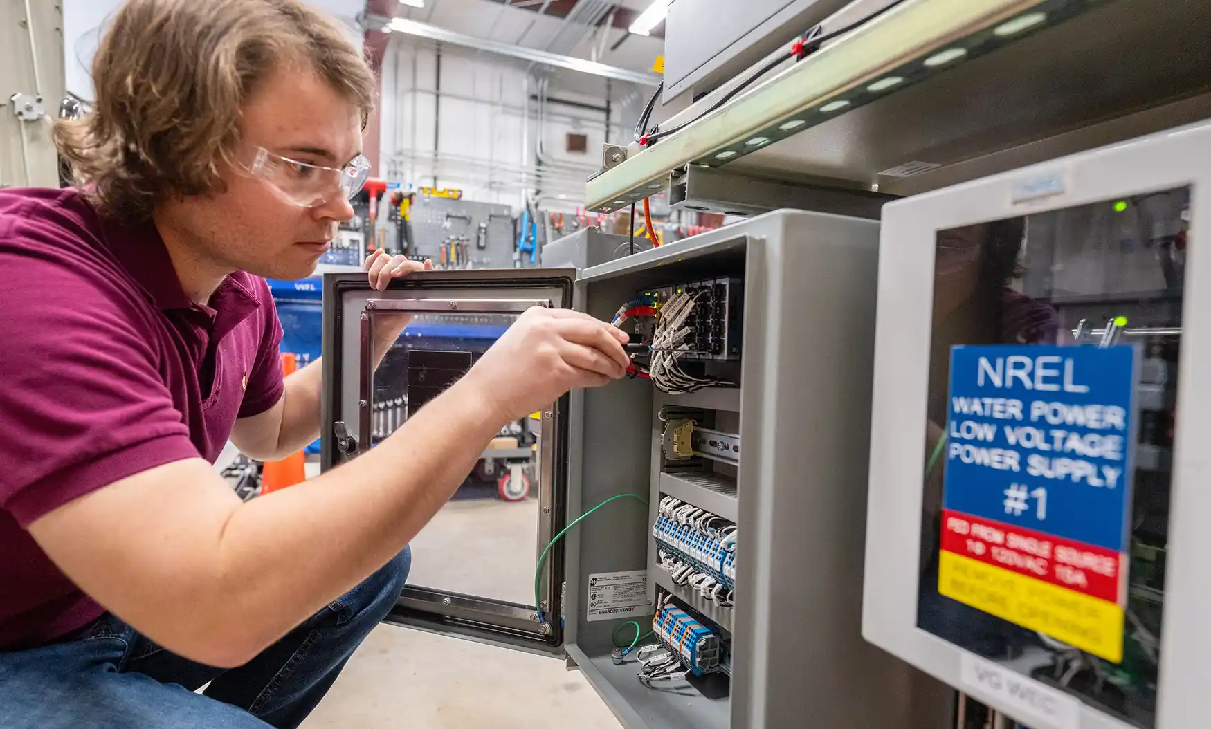Researcher works on hardware-in-the-loop testing for variable geometry wave energy converters.