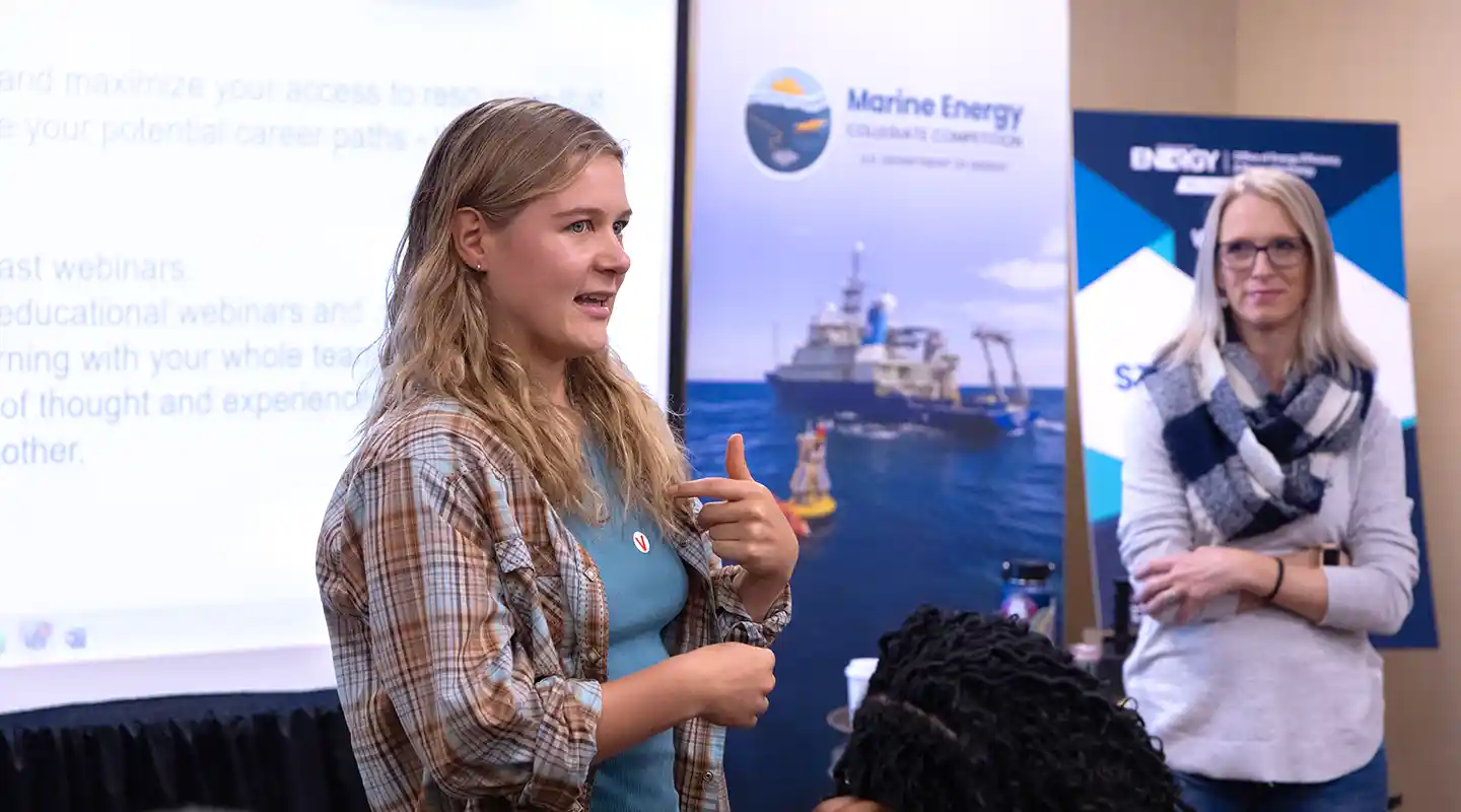 Student presents ideas at competition.