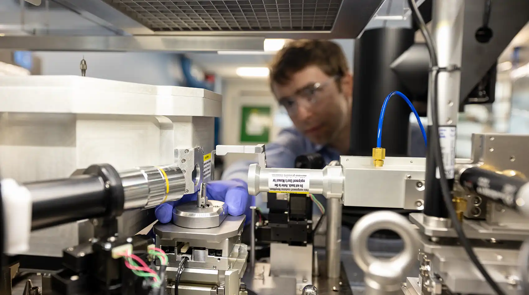 A person using a piece of scientific equipment in a laboratory setting.