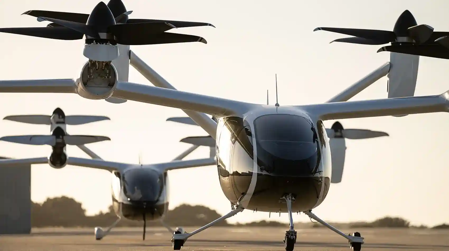 Two quadcopter-style vertical take-off and landing aircraft.