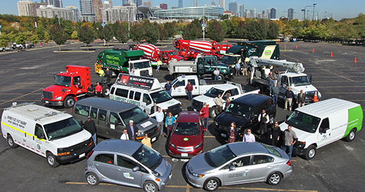 People standing within circles of a variety of different vehicle types.