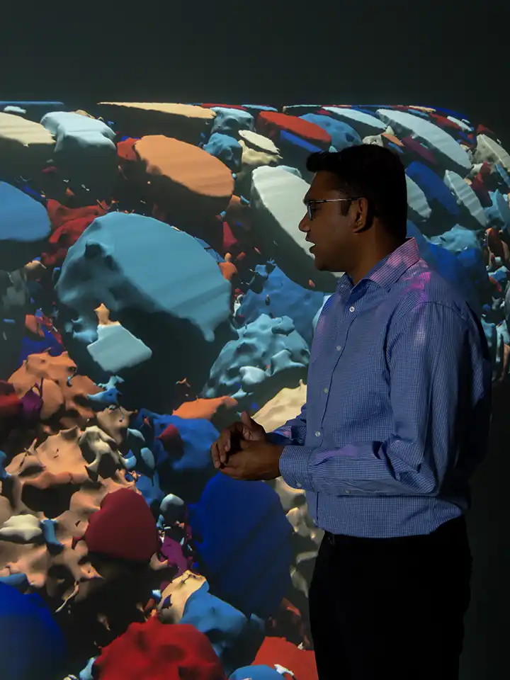 Researchers discuss a 3D data visualization of a battery microstructure