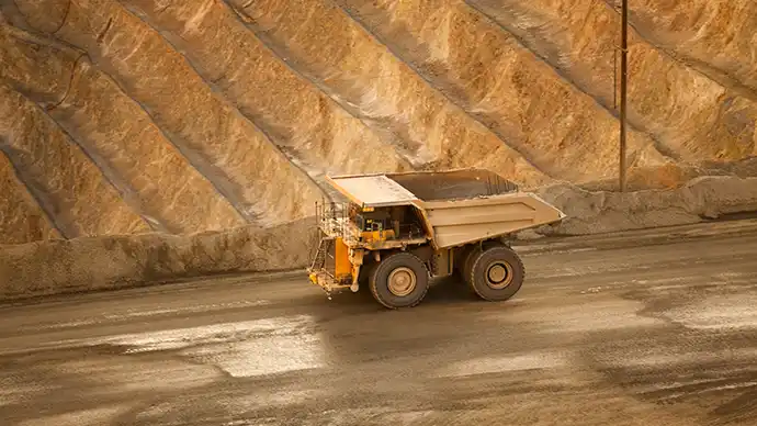 A dump truck in an open mine pit