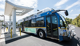 A hydrogen fuel cell bus at a hydrogen fueling station