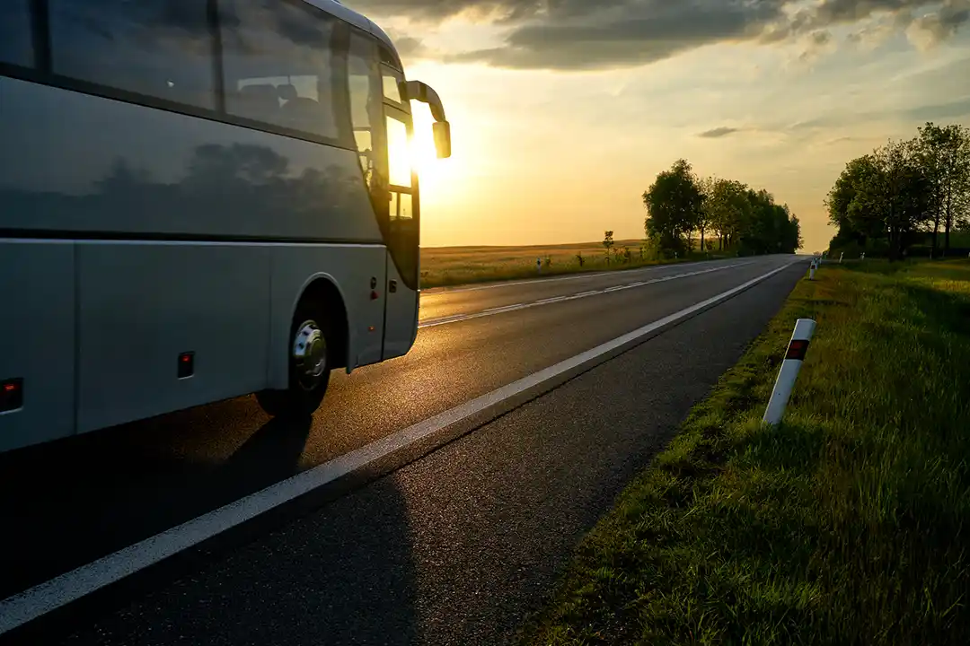 A bus traveling on a rural highway.